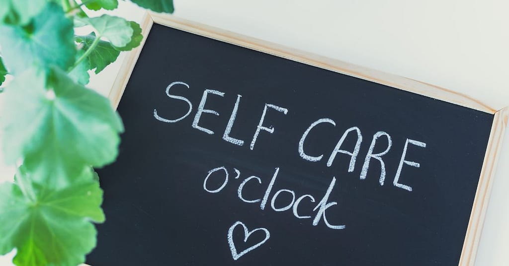 chalkboard that reads "self-care o'clock"